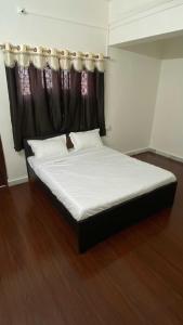 Postel nebo postele na pokoji v ubytování SPOT ON Rajyog Resort