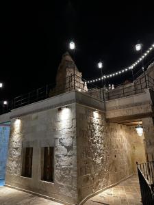 a building with lights on top of it at night at Noah's Ark Cave Hotel in Göreme