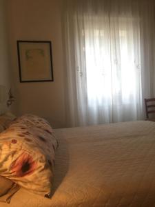 Postel nebo postele na pokoji v ubytování Marie Home Florence