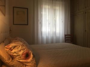 Postel nebo postele na pokoji v ubytování Marie Home Florence