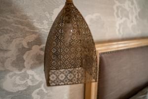 a copper object is hanging on a wall at Valencia 2 bed Luxury Guest house in Godella