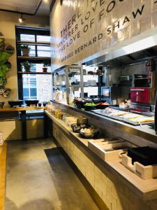 a kitchen with a buffet of food in a restaurant at City Spa Nijmegen in Nijmegen