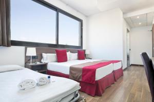 Postel nebo postele na pokoji v ubytování Hotel Best 4 Barcelona