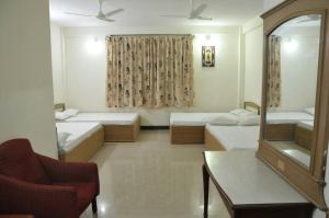 Katil atau katil-katil dalam bilik di MYSORE MAHALAKSHMI ROOMS