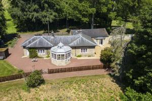 an aerial view of a large house with a garden at Eslington Lodge in Alnwick