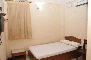 Katil atau katil-katil dalam bilik di MYSORE MAHALAKSHMI ROOMS