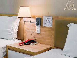 Postel nebo postele na pokoji v ubytování Bella Hotel Bai Sau Vung Tau