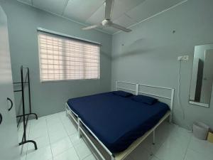 Katil atau katil-katil dalam bilik di Ruwa Homestay