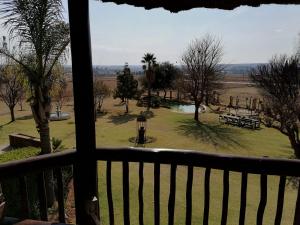 a view of a park from a balcony at Kwena Maribane Lodge in Erasmus +9 photos