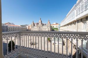 a view of the city from a balcony at Lux Maria Pita Corazon de Coruña in A Coruña