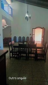 a dining room with a table and chairs at Pousada Litoral Norte Caragua in Caraguatatuba