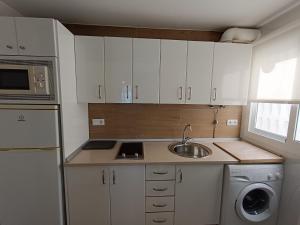 Kuchyň nebo kuchyňský kout v ubytování Villablanca Apartamento