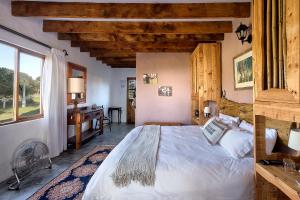 Postel nebo postele na pokoji v ubytování TNiqua Stable Inn