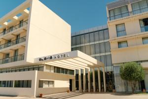 an office building with theania hotel in front of it at ONOMO Airport Casablanca in Casablanca