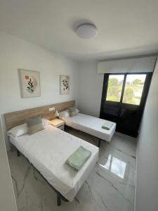 Un pat sau paturi într-o cameră la Casa Ana-Luisa (Villamartin - Luxury Holiday Apartment) +22 fotografii
