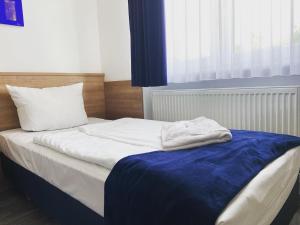 Postel nebo postele na pokoji v ubytování Sunny Hotel Straubing