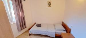 Łóżko lub łóżka w pokoju w obiekcie Holiday Houses Marta