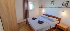 Łóżko lub łóżka w pokoju w obiekcie Holiday Houses Marta