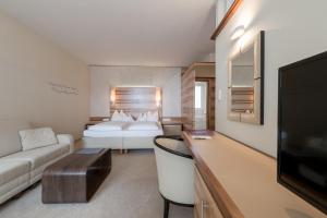 TV a/nebo společenská místnost v ubytování Hotel Olympia