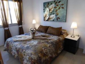 Posteľ alebo postele v izbe v ubytovaní Dalí Apartment