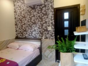 Postel nebo postele na pokoji v ubytování An Chi Hotel