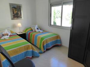 Posteľ alebo postele v izbe v ubytovaní Dalí Apartment