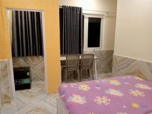 Postel nebo postele na pokoji v ubytování An Chi Hotel