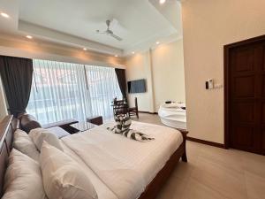 Postel nebo postele na pokoji v ubytování Pratamnak Residence