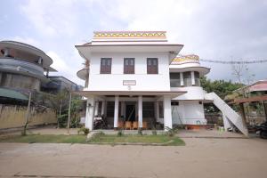 a large white building with a round top at ROYAL STAY VINTAGE in Madurai