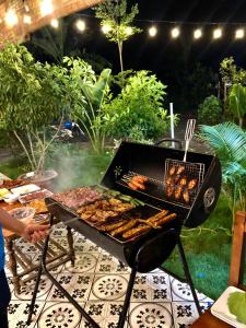 a grill with many different types of food on it at Rosa Garden in Ninh Binh