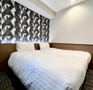 Postel nebo postele na pokoji v ubytování KIN HOTEL