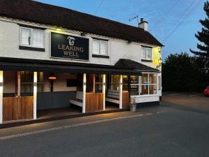 a building with a sign that reads learning well at Leaking Well, Dunhampton in Stourport +19 photos