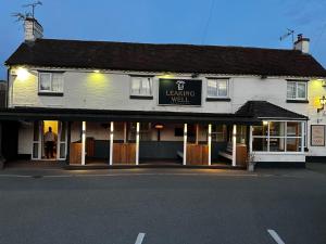 a building with a sign that reads healing well at Leaking Well, Dunhampton in Stourport