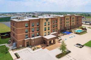an aerial view of a building with a pool at Homewood Suites By Hilton San Marcos in San Marcos