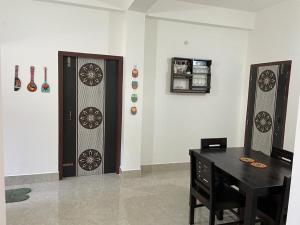 a room with two doors with wheels on the wall at Hrishi’s home in Guwahati