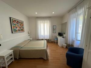 Voodi või voodid majutusasutuse Hotel L'Isola toas