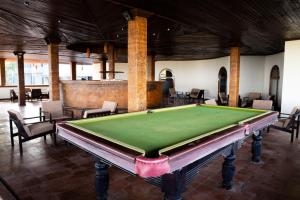 a pool table in the middle of a room at Peacock Beach Resort and Spa in Hambantota