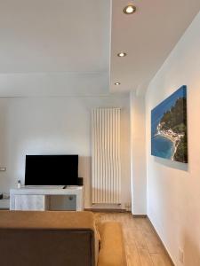 TV a/nebo společenská místnost v ubytování appartamento fronte mare + 24 fotografií