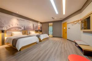 a hotel room with two beds in a room at Thank Inn Plus Ordos Qipanjing Government Affairs Service Center in Shizuishan
