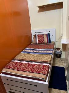 two stairs in a room with pillows on them at Moon Backpackers , Al Rigga , Partition for Couples and for singles in Dubai