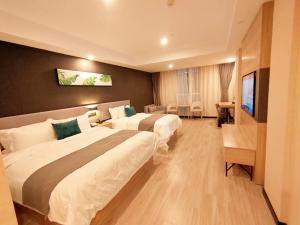 En eller flere senge i et værelse på Thank Inn Zaozhuang Tengzhou Jinghe Road Zhenai Mall