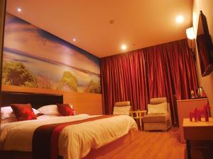 Tempat tidur dalam kamar di Junyi Hotel Jinhua Wuyi Hot Spring Bus Terminal Station