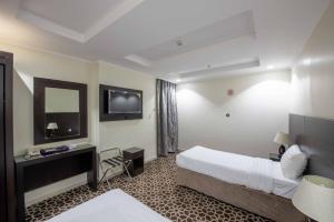 Postel nebo postele na pokoji v ubytování Abdul Hafez Al Humaidan Hotel
