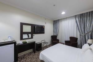 TV a/nebo společenská místnost v ubytování Abdul Hafez Al Humaidan Hotel