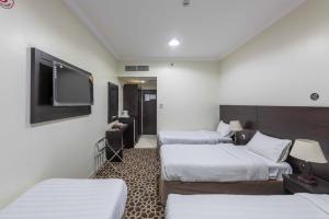 Postel nebo postele na pokoji v ubytování Abdul Hafez Al Humaidan Hotel
