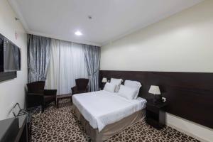 TV a/nebo společenská místnost v ubytování Abdul Hafez Al Humaidan Hotel