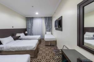 Postel nebo postele na pokoji v ubytování Abdul Hafez Al Humaidan Hotel