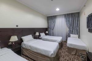 Postel nebo postele na pokoji v ubytování Abdul Hafez Al Humaidan Hotel