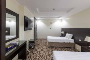 Postel nebo postele na pokoji v ubytování Abdul Hafez Al Humaidan Hotel