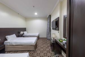 Postel nebo postele na pokoji v ubytování Abdul Hafez Al Humaidan Hotel